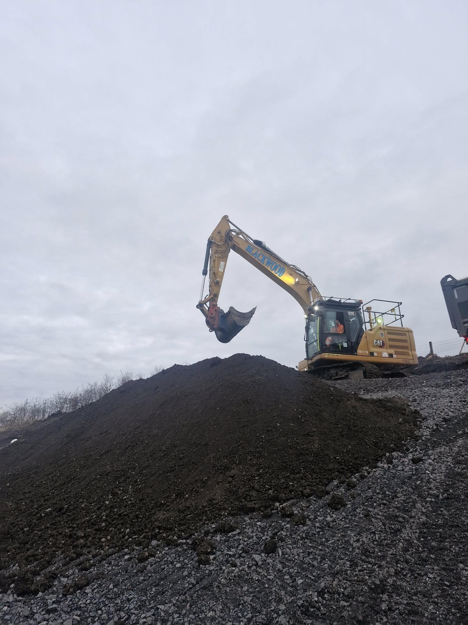 Heavy excavator working on groundworks project