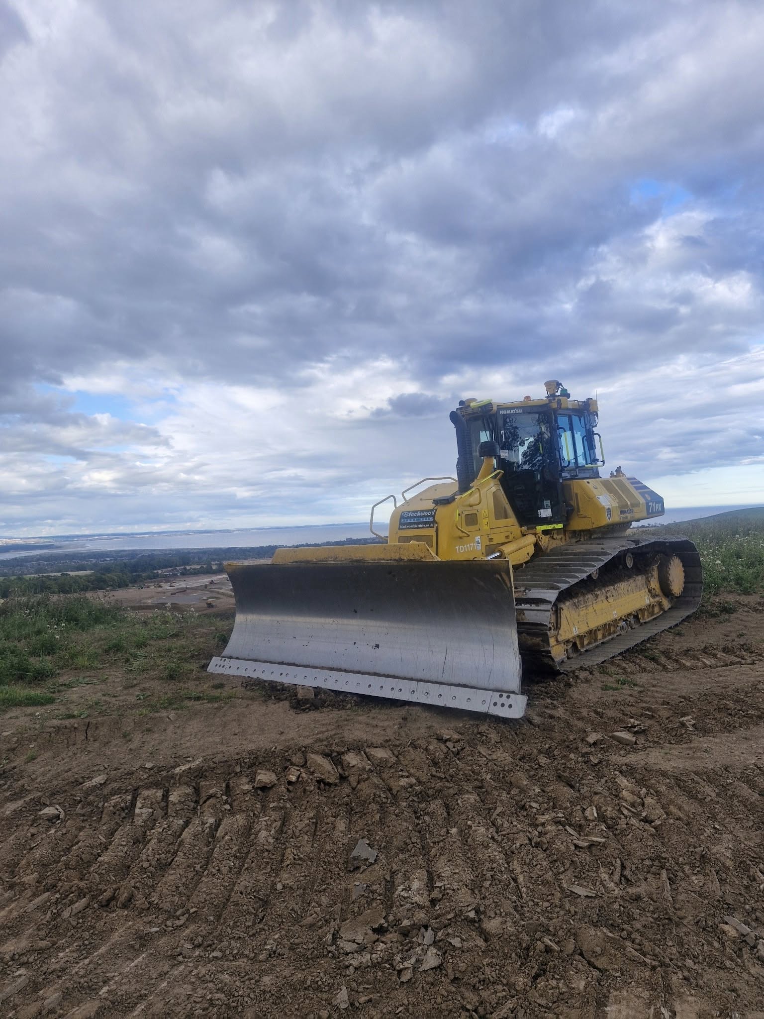 Excavator operating in rugged terrain